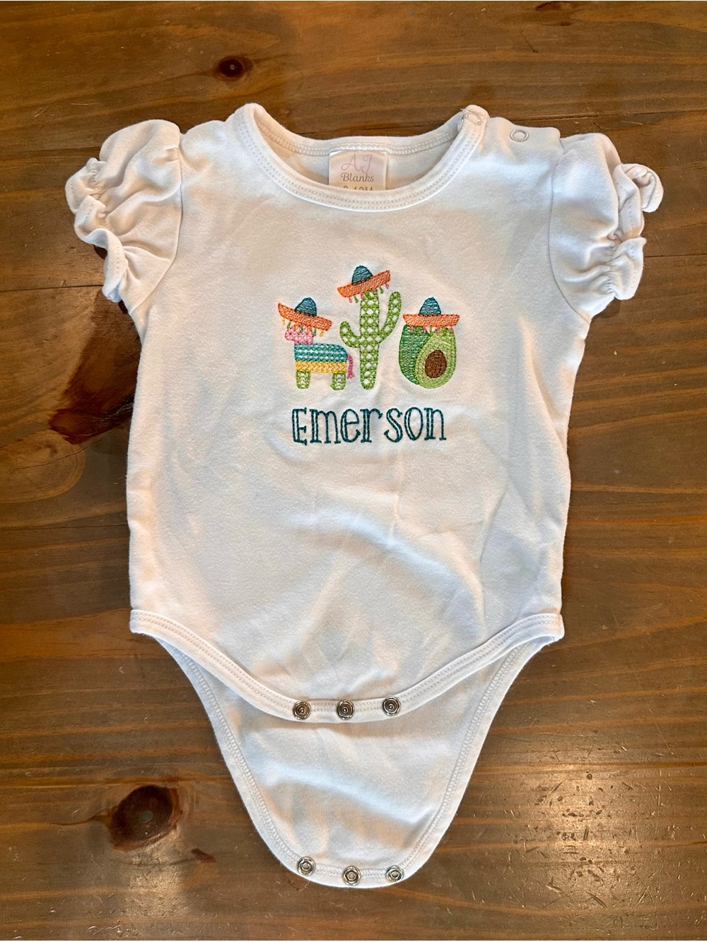 White Baby Onesie with Colorful Fiesta Embroidery - Emerson